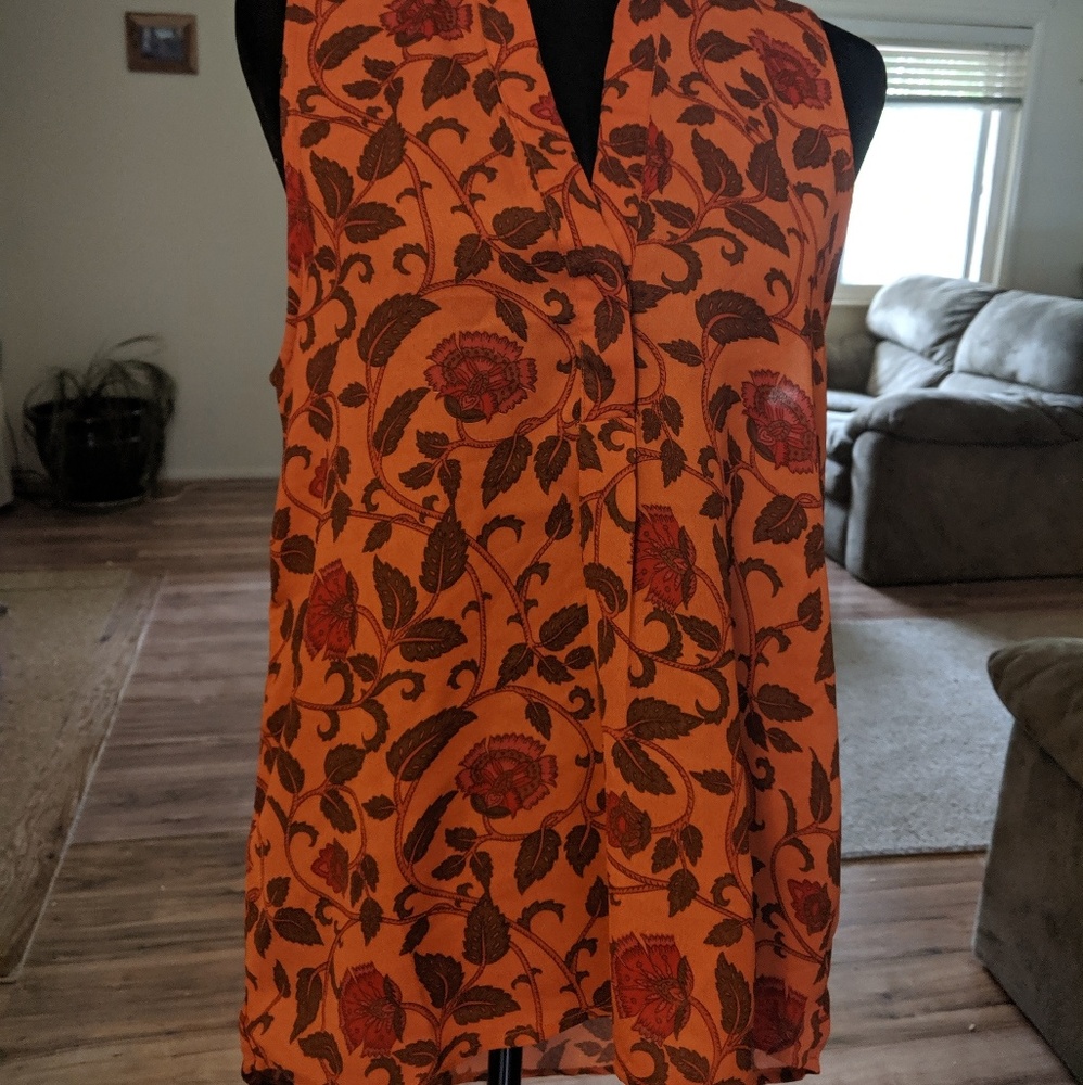 Beautiful high low top. Size medium. Let it be.